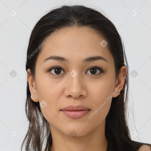 Joyful latino young-adult female with long  brown hair and brown eyes