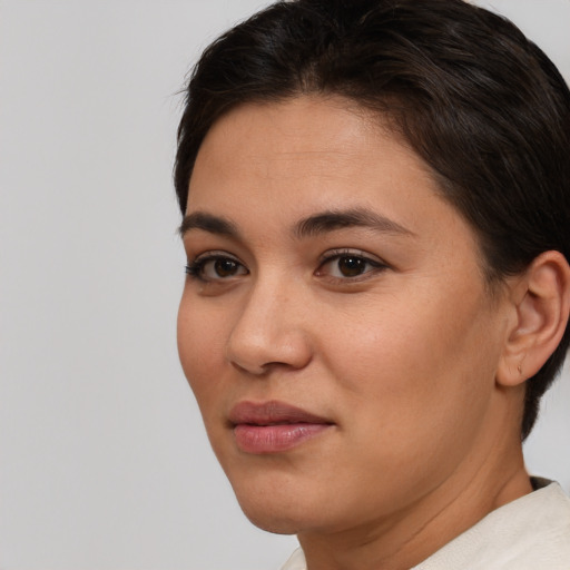 Joyful white young-adult female with short  brown hair and brown eyes