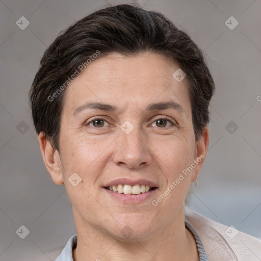 Joyful white adult female with short  brown hair and brown eyes