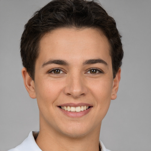 Joyful white young-adult female with short  brown hair and brown eyes