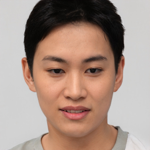 Joyful asian young-adult female with short  black hair and brown eyes