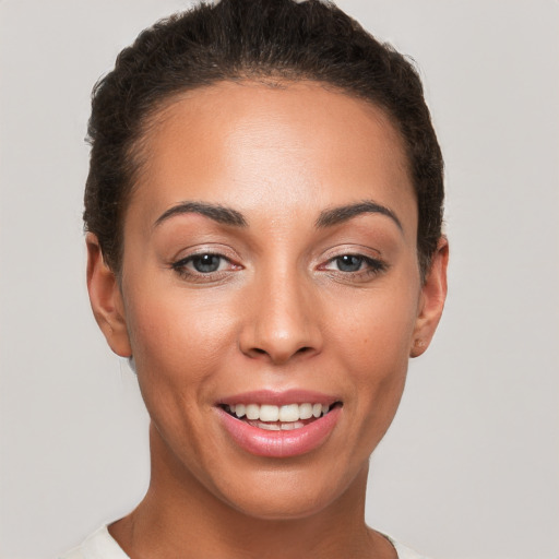 Joyful white young-adult female with short  brown hair and brown eyes