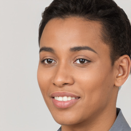 Joyful latino young-adult female with short  brown hair and brown eyes