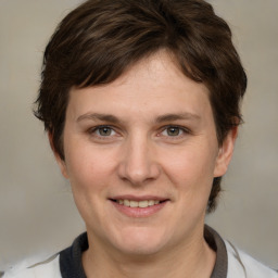 Joyful white adult female with medium  brown hair and grey eyes