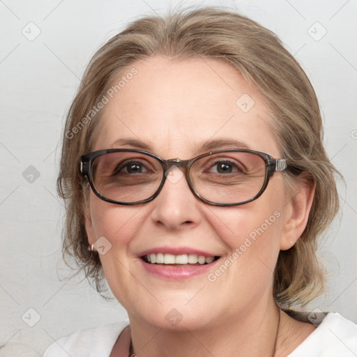 Joyful white adult female with medium  brown hair and blue eyes