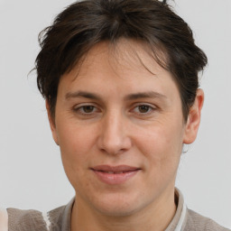 Joyful white adult female with short  brown hair and brown eyes