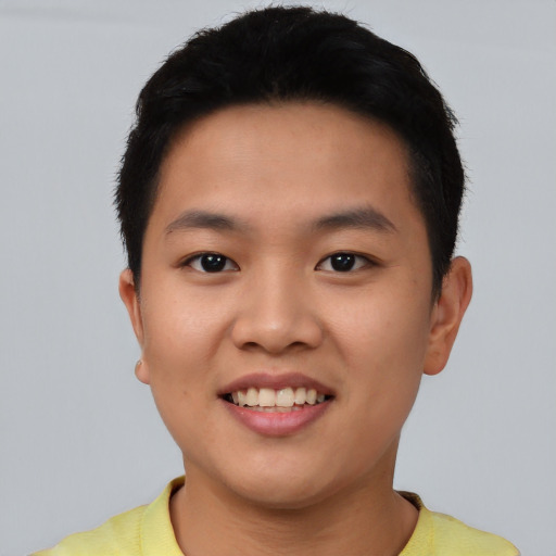 Joyful asian young-adult male with short  black hair and brown eyes