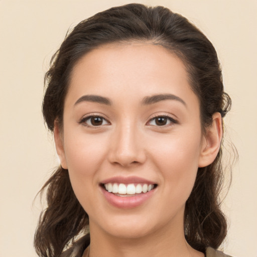 Joyful white young-adult female with medium  brown hair and brown eyes