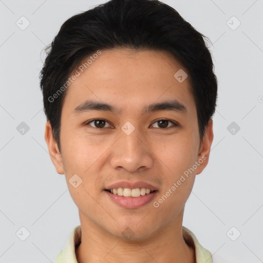 Joyful asian young-adult male with short  black hair and brown eyes