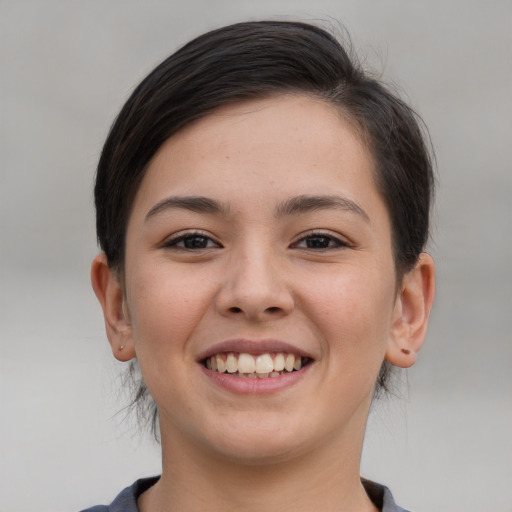 Joyful white young-adult female with medium  brown hair and brown eyes