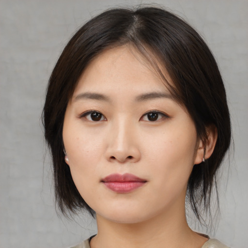Neutral asian young-adult female with medium  brown hair and brown eyes
