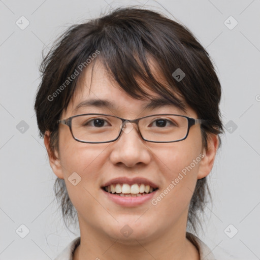 Joyful white adult female with medium  brown hair and brown eyes