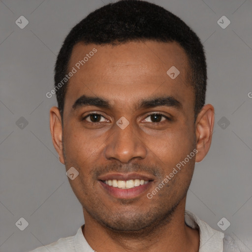 Joyful black young-adult male with short  black hair and brown eyes