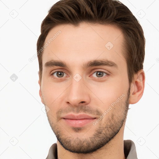 Joyful white young-adult male with short  brown hair and brown eyes