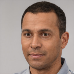 Neutral white adult male with short  black hair and brown eyes