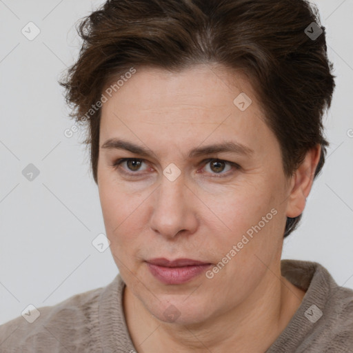 Joyful white adult female with short  brown hair and brown eyes