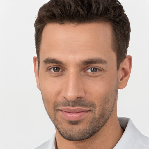 Joyful white young-adult male with short  brown hair and brown eyes