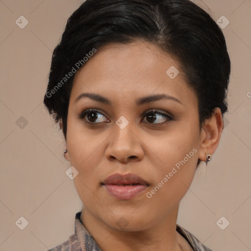 Joyful latino young-adult female with medium  brown hair and brown eyes