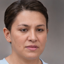 Joyful white adult female with short  brown hair and brown eyes