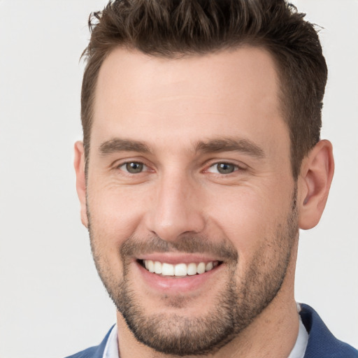 Joyful white young-adult male with short  brown hair and brown eyes