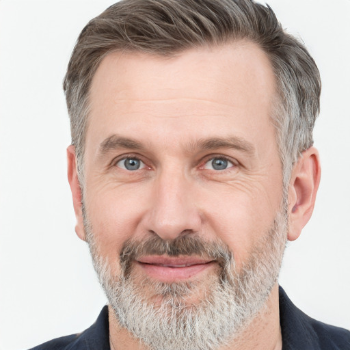 Joyful white adult male with short  brown hair and grey eyes