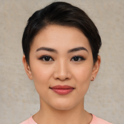 Joyful asian young-adult female with short  black hair and brown eyes