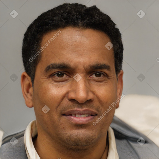 Joyful latino adult male with short  black hair and brown eyes