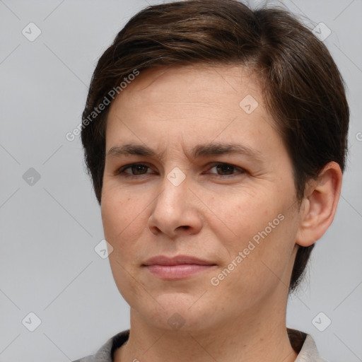 Joyful white adult female with short  brown hair and brown eyes