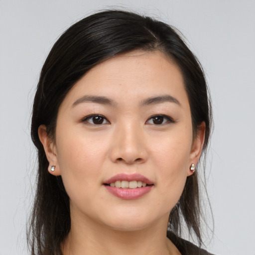 Joyful asian young-adult female with long  brown hair and brown eyes