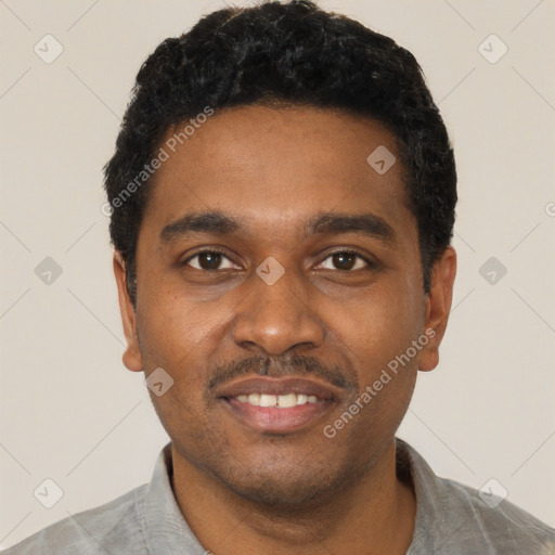 Joyful black young-adult male with short  black hair and brown eyes
