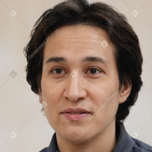 Joyful white adult male with medium  brown hair and brown eyes