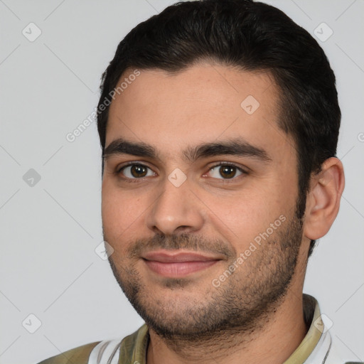 Joyful white young-adult male with short  black hair and brown eyes