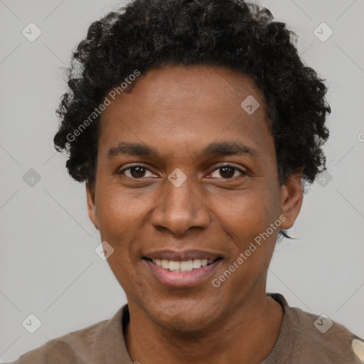 Joyful black young-adult male with short  black hair and brown eyes