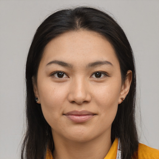 Joyful asian young-adult female with long  brown hair and brown eyes