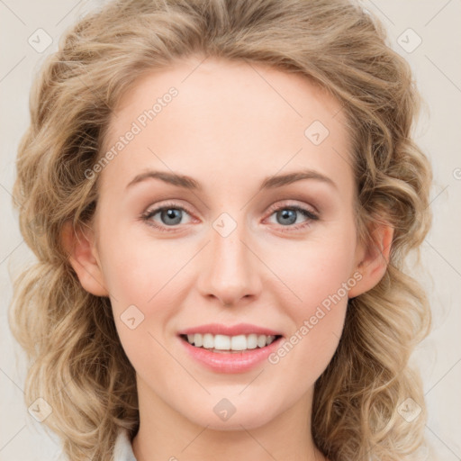 Joyful white young-adult female with long  brown hair and blue eyes