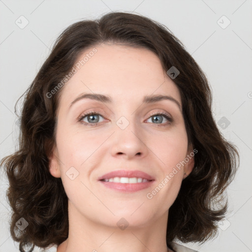 Joyful white young-adult female with medium  brown hair and green eyes