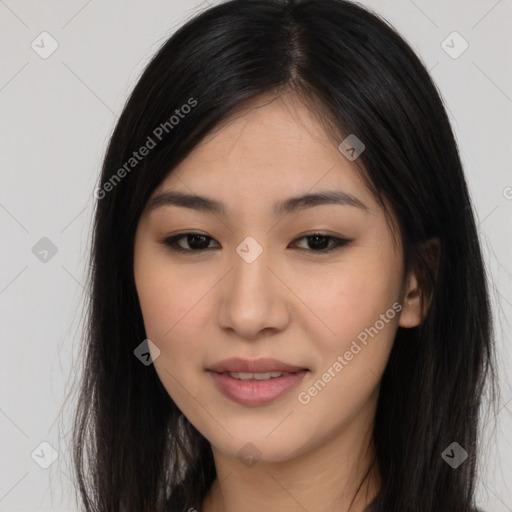 Joyful asian young-adult female with long  brown hair and brown eyes