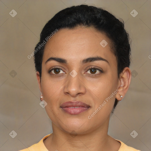 Joyful latino young-adult female with short  black hair and brown eyes