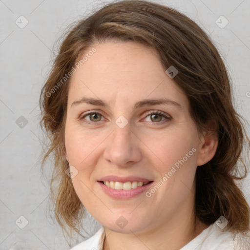 Joyful white young-adult female with medium  brown hair and green eyes