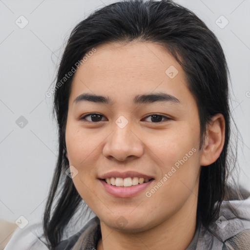 Joyful asian young-adult female with medium  brown hair and brown eyes