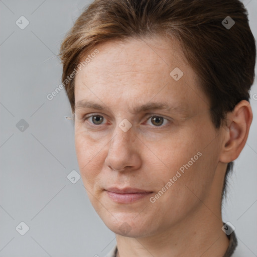 Joyful white adult female with short  brown hair and brown eyes