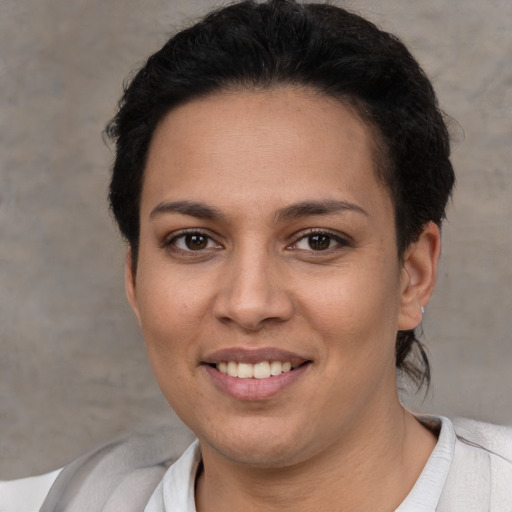 Joyful white young-adult female with short  brown hair and brown eyes