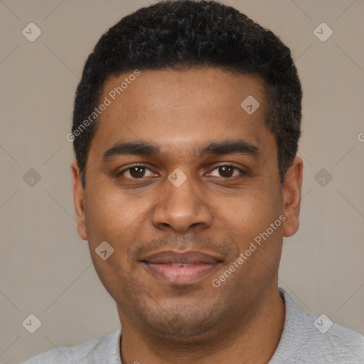 Joyful black young-adult male with short  black hair and brown eyes