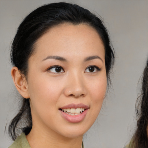 Joyful white young-adult female with medium  brown hair and brown eyes