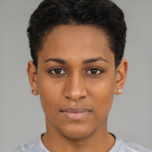 Joyful black young-adult female with short  brown hair and brown eyes