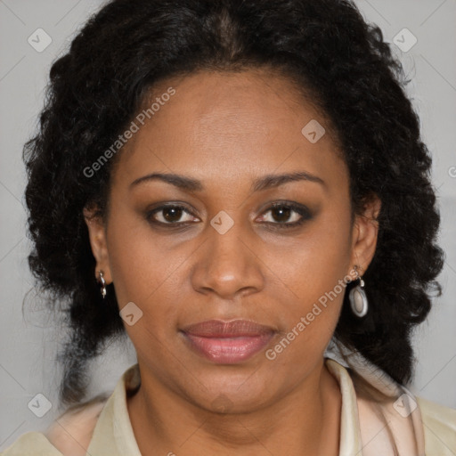 Joyful black adult female with medium  brown hair and brown eyes