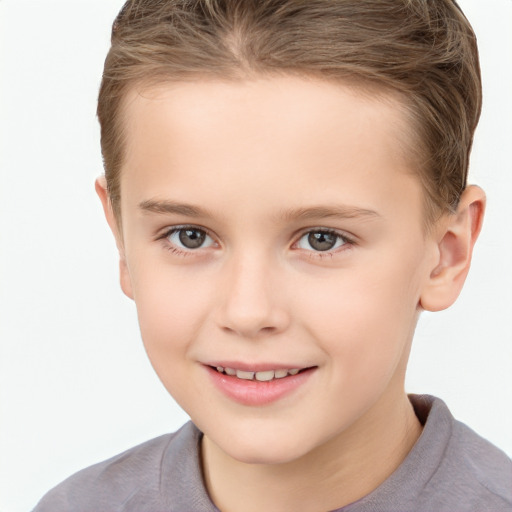 Joyful white child female with short  brown hair and brown eyes