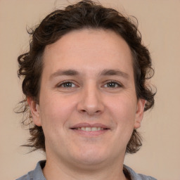 Joyful white young-adult male with medium  brown hair and brown eyes