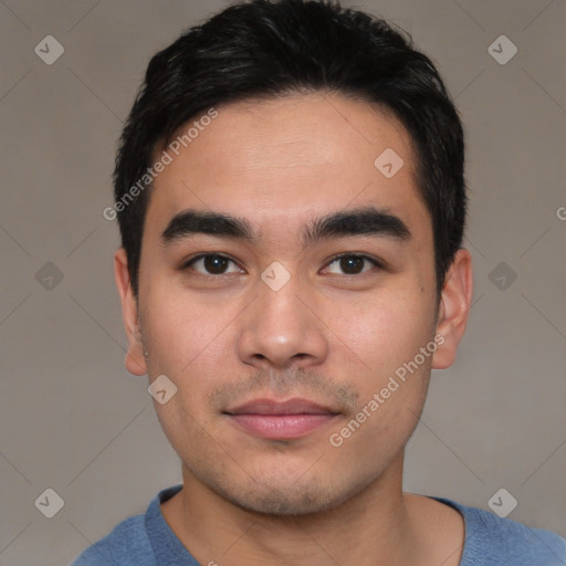 Joyful asian young-adult male with short  black hair and brown eyes