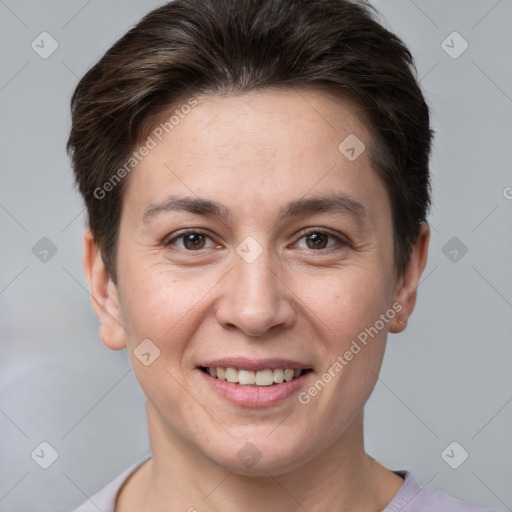 Joyful white young-adult female with short  brown hair and brown eyes